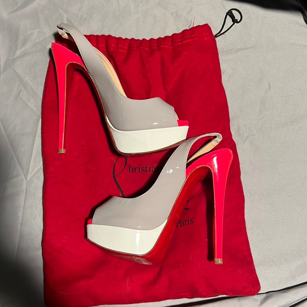 Pink, gray, and white Christian Louboutin heels